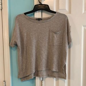 Cream short sleeved top with front pocket from AEO